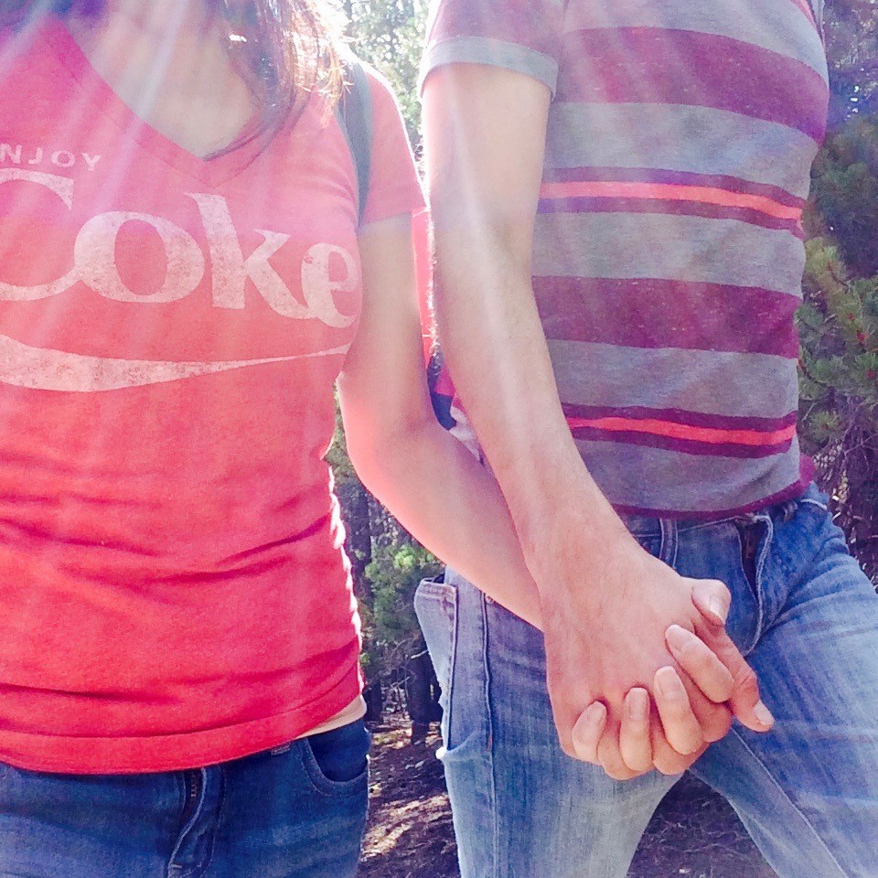 Nick and Cuc holding hands